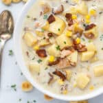 White Bowl full of New England Clam Chowder with oyster crackers