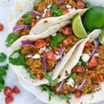 red lentil tacos made from vegetarian taco meat in flour tortillas