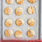 tray full of Christmas cookies with candy canes