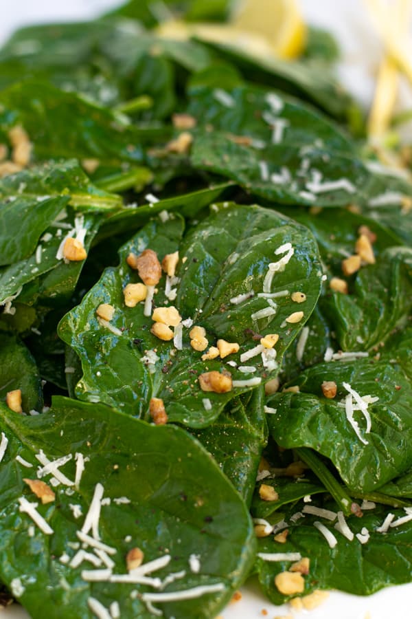 close up of a piece of spinach in the simple spinach salad