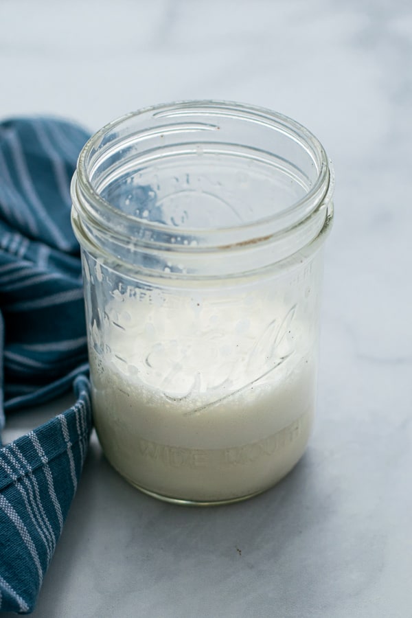 foam and steamed milk in a jar
