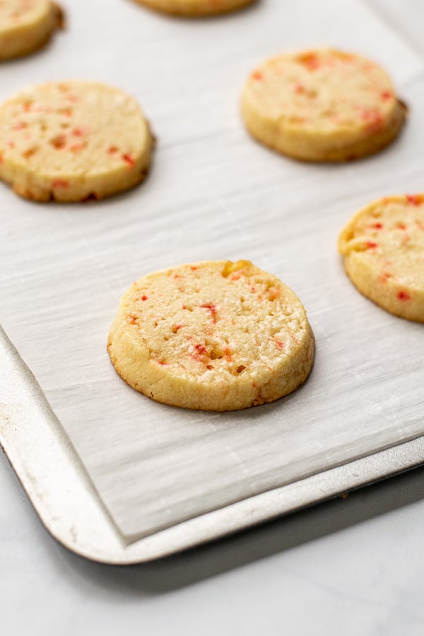 freshly baked slice and bake peppermint cookies on a baking sheet tray