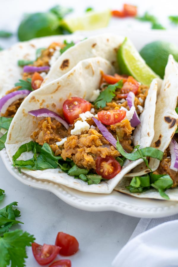 single vegetarian taco on a white plate