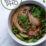 garnishes, noodles, and beef in flavorful broth made in the crockpot