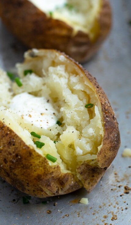 Baked Potato made in the pressure cooker sliced open revealing fluffy perfectly cooked inside