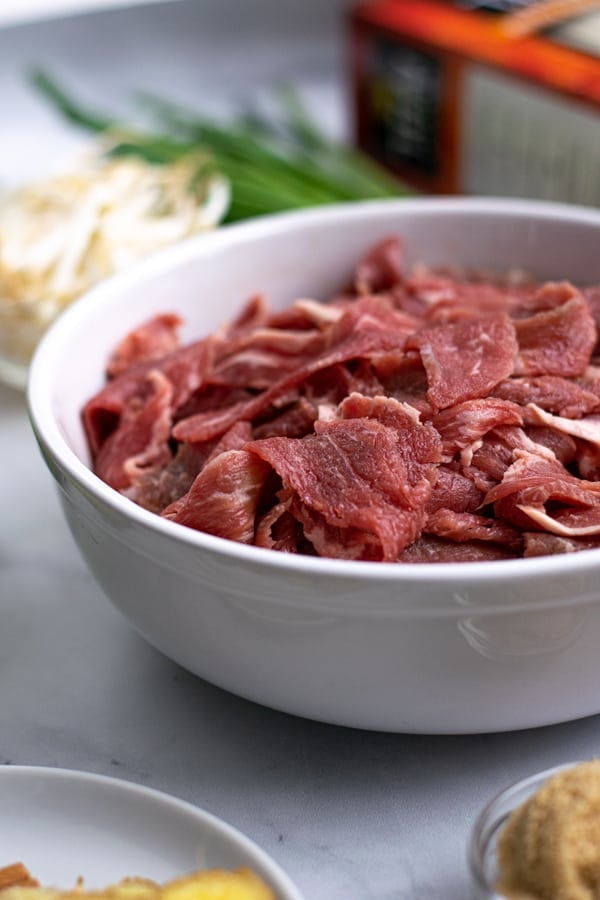 shaved steak in a bowl for the pho soup recipe