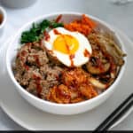 white bowl on table with Korean bibimbap made with ground turkey
