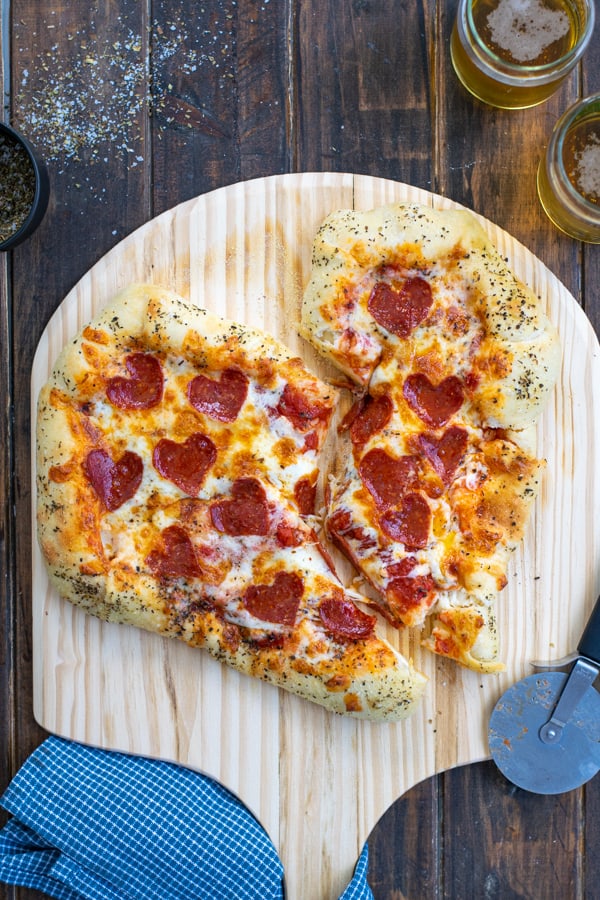 heart shaped pizza cut in half like a broken heart