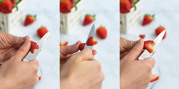 step by step photo of slicing a strawberry into a heart with a paring knife