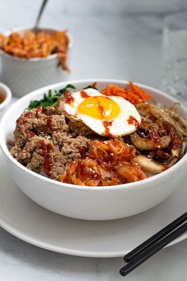 Korean Ground Turkey Bibimbap made with rice, vegetables, eggs, and kimchi