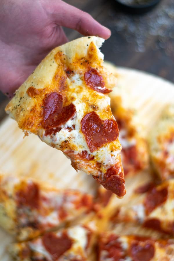 slice of pizza with pepperoni hearts