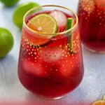 pinterest pin for Hibiscus Iced Tea Sparkler showing bright red tea with limes and ice