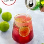 pinterest pin for Hibiscus Iced Tea Sparkler showing seltzer being poured into bright red tea