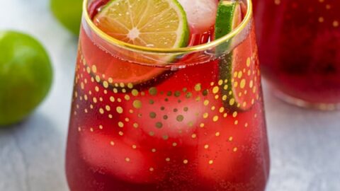 Hibiscus Iced Tea Sparkler in a glass with ice and limes
