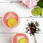 Pinterest Pin with title of recipe Hibiscus Margaritas and a picture of 2 bright pink margaritas