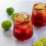 pinterest pin with recipe title showing a photo of two glasses of Hibiscus Iced Tea Sparkler