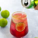 pinterest pin for Hibiscus Iced Tea Sparkler showing seltzer being poured into a glass