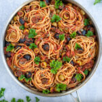 Pasta Puttanesca Pinterest Pin showing large pan full of pasta