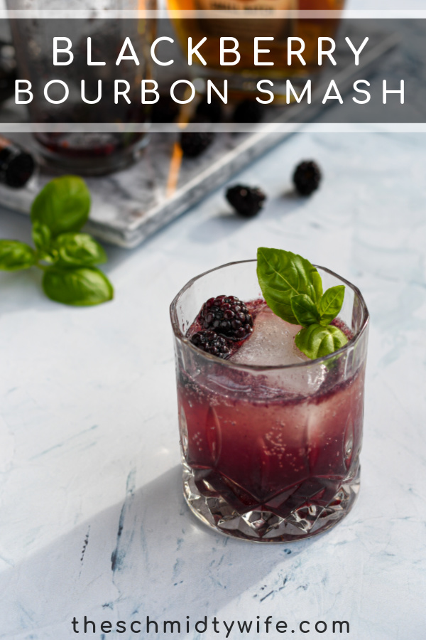 Pinterest Pin for Bourbon Blackberry Smash Cocktail showing photo of purple drink garnished with basil leaves and fresh blackberries