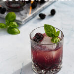 Pinterest Pin for a recipe for a Blackberry Bourbon Smash with a photo of a purple drink in an old fashion glass
