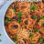 Pinterest Pin Labeled Pasta Puttanesca shows large skillet full of spaghetti with a fork