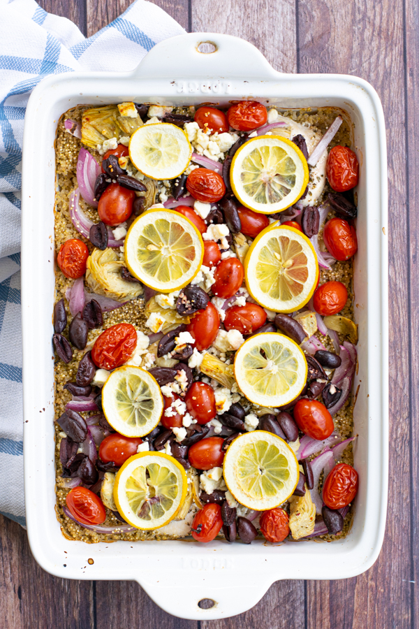 just baked greek chicken bake from overhead in a white baking dish