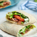 Pinterest Pin for Healthy BLT Wraps showing a photo of a BLT wrap cut open to show off a secret sauce, bacon, lettuce, tomatoes