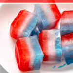 Pinterest Pin for red, white, and blue ice cubes showing a bowl full of large colorful layered ice cubes