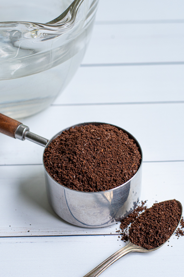 medium/course ground coffee in a measuring cup