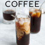 Pinterest Pin for How to make Cold Brew Coffee showing a glass filled with iced coffee with swirls of freshly poured milk
