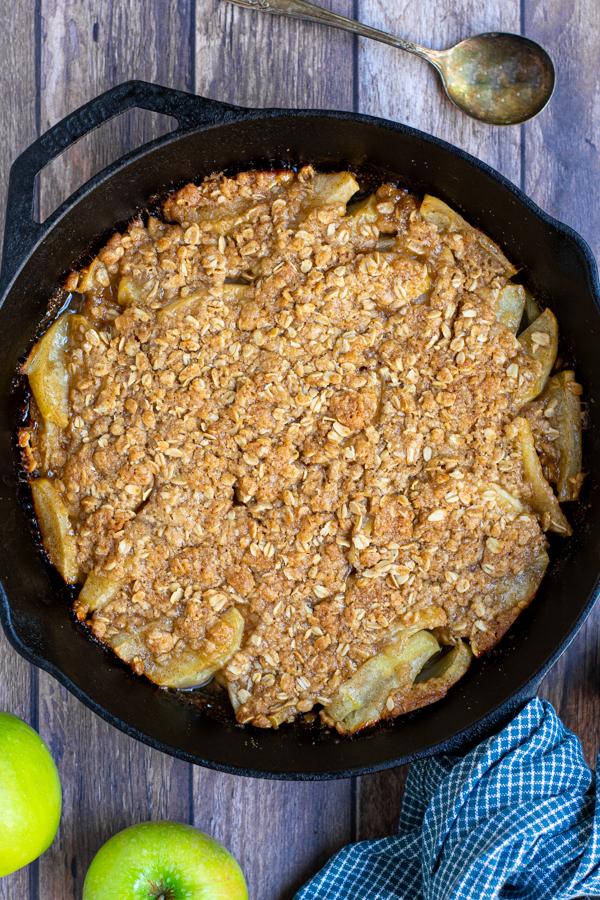 freshly make apple crisp on the grill in a cast iron pan