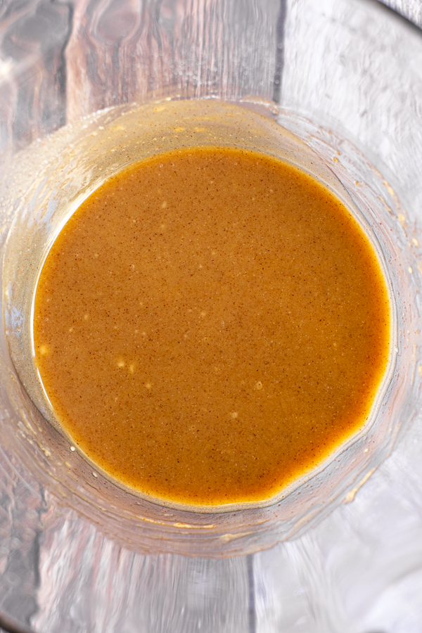 filling all mixed together in a glass bowl for apple crisp