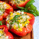 Pinterest Pin for Grilled Stuffed Bell Peppers showing a close up of a grilled red pepper on a serving tray