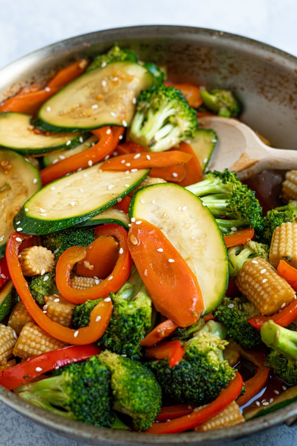 close up of brightly colored stir fry vegetables in a skillet