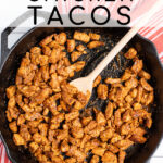 Pinterest Pin with text overlay Quick Chicken Tacos showing image of chicken taco filling in a cast iron pan.