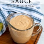 Pinterest Pin with text overlay Healthy Southwest Sauce showing photo of glass measuring cup filled with sauce.