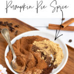 Pinterest Pin with text overlay Pumpkin Pie Spice includes a photo of plate of spices being mixed together.