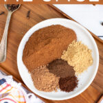 Pinterest Pin with text overlay Homemade Pumpkin Pie Spice includes a photo of spices picked on a small white plate.