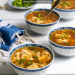 Pinterest Pin with text over lay 'Quick & Easy, Egg Drop Soup' with image of small bowl full of soup and topped with green onions.