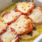 Pinterest Pin with text overlay 'Easy Pesto Chicken Bake' showing a fished chicken bake with pesto, tomatoes, and melted mozzarella cheese.