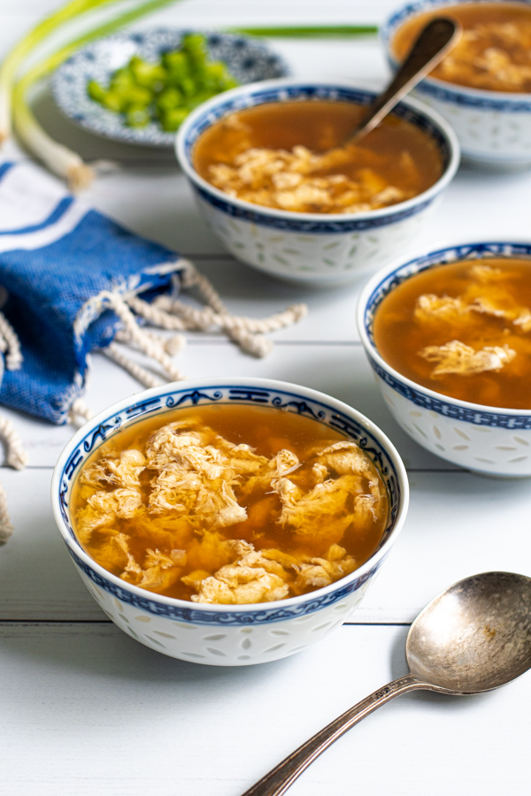 Small blue & white bowls of egg drop soup.