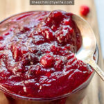 Pinterest Pin with text: How to make Fresh Homemade Cranberry Sauce. Image of bowl of cranberry sauce next to loose cranberries.