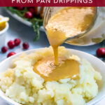 Pinterest Pin with text, How to Make Turkey Gravy From Pan Drippings. Image of turkey gravy being poured into a huge bowl of mashed potatoes.