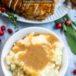 Pinterest Pin with text, Turkey Gravy The Easy Way From Pan Drippings. Image of bowl of mashed potatoes with a large pool of turkey gravy on top.