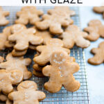 Pinterest Pin with text overlay, How to make Soft Gingerbread with Glaze. Image of gingerbread cookies on a wire rack.