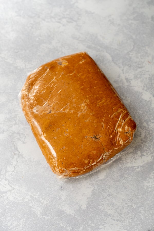 Gingerbread Cookie Dough wrapped tight in plastic wrap.