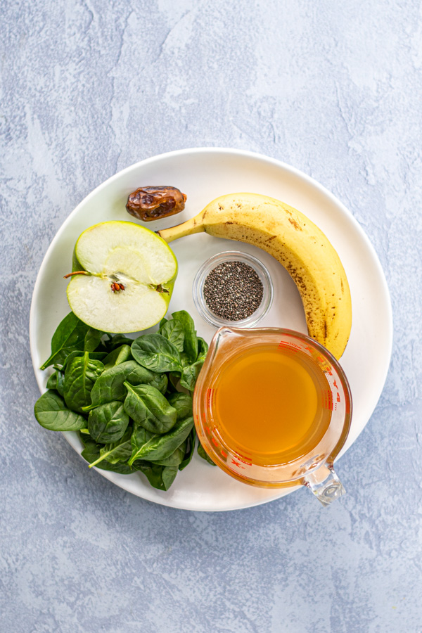 Ingredients all sitting on a plate for green smoothie made with green tea.