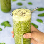 Pinterest Pin with text over lay 'Green Smoothie for focus & energy'. Image of glass full of bright green smoothie.