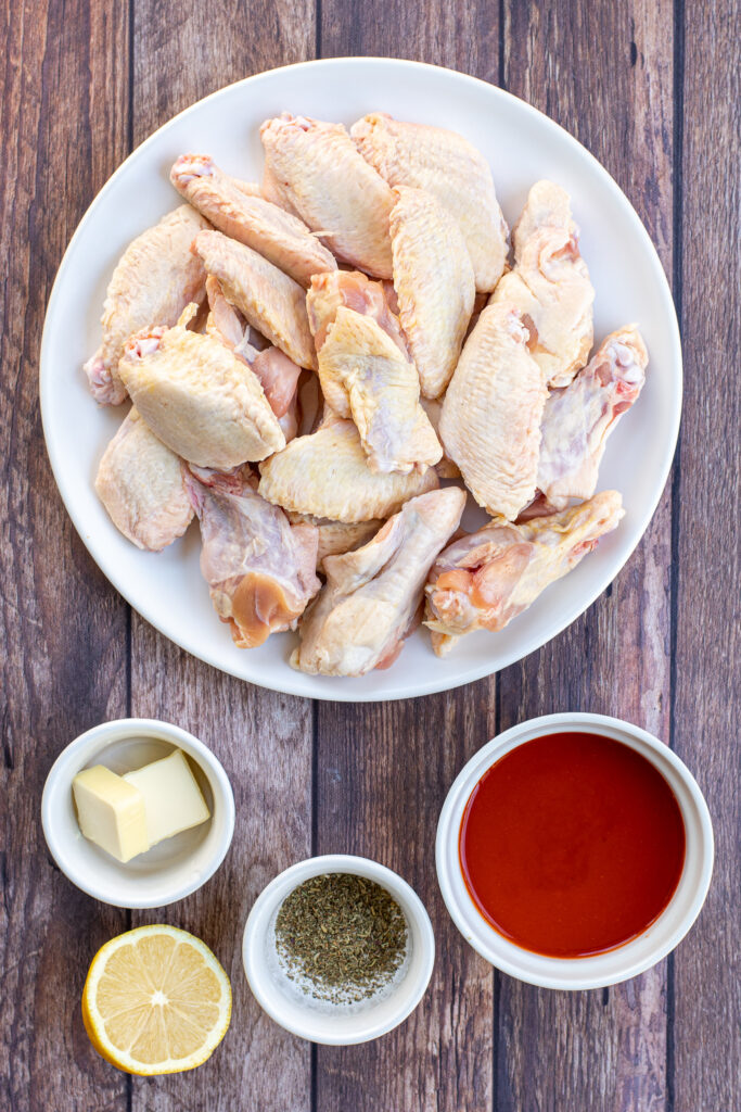 Ingredients needed to make chicken wings in a the instant pot and ingredients needed to make the sauce.
