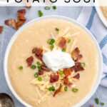 Pinterest Pin for with text overlay 'Instant Pot Loaded Baked Potato Soup'. Image of bowl of garnished baked potato soup.